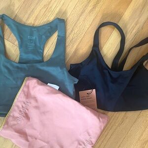 Two NWT girlfriend collective sports bras! Size small. Comes with dust bag :)